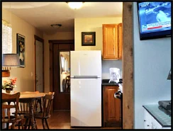 The Blue Duck Suite’s kitchen is equipped with dinette, range, refrigerator, microwave and coffee maker.