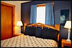 Rest well on a comfy queen bed in the Blue Duck Suite near Joseph, Oregon.