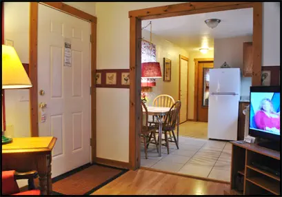 The Red Rooster Suite’s kitchen is outfitted with full-sized refrigerator, range, microwave and cookware.