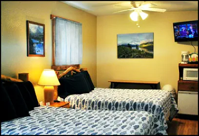 The Mountain Lakes room has two double beds, satellite TV, microwave, fridge and air conditioning.