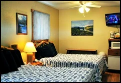 The Mountain Lakes room has two double beds, satellite TV, microwave, fridge and air conditioning.