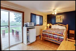 The Fishermans Room with queen bed, flat-screen TV and back deck near Wallowa Lake.