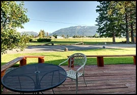 Enjoy the Birdwatchers deck with patio furniture and view of Chief Joseph Mountain