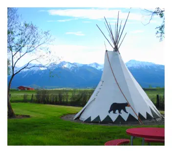 Tepees in spring at Mountain View RV Park with snow-capped Wallowa Mtns backdrop  